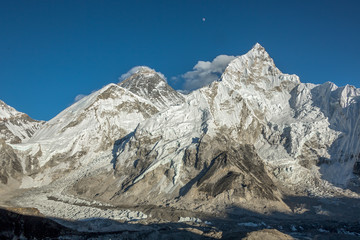 The Moon, mount Everest (8848 m), and Nuptse (7864 m) in the evening (view from Kala Patthar) -...