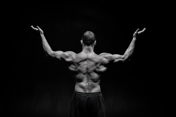 Fototapeta na wymiar handsome bodybuilder man with muscular body training and posing