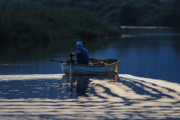 Fisherman at sunrise in Playa Valledoria 