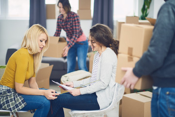 Group of friends moving into new apartment