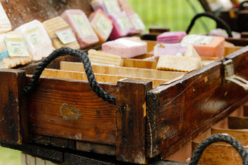 Old style wooden chest filled with handmade soaps