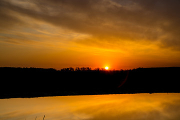 Fototapeta premium Spring dawn on the river Don is reflecting in calm water
