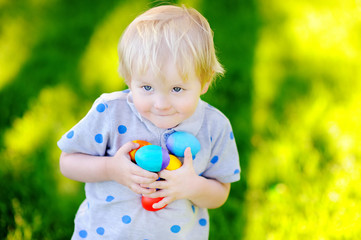 Little boy hunting for easter egg on Easter day