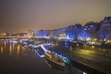 Fototapeta na wymiar Night view of Weser river in Bremen, Germany.