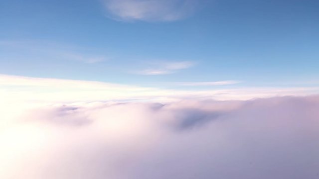 Airplane decent on sonset clouds