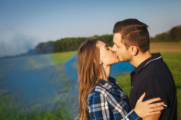 Young affectionate couple kissing tenderly