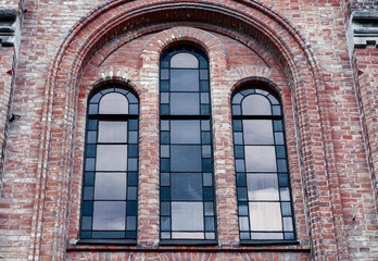 Window with stained glass windows in a brick building