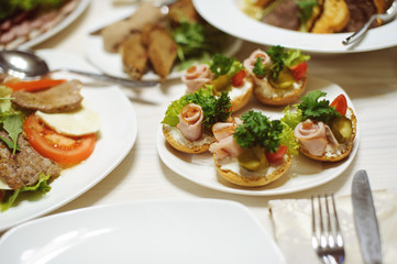 table set service with silverware and glass stemware at restaurant before party