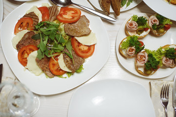 table set service with silverware and glass stemware at restaurant before party