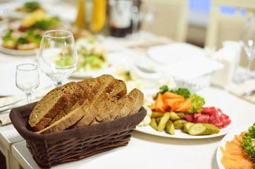 table set service with silverware and glass stemware at restaurant before party