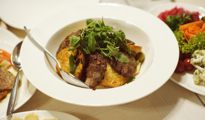 table set service with silverware and glass stemware at restaurant before party