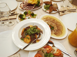 table set service with silverware and glass stemware at restaurant before party