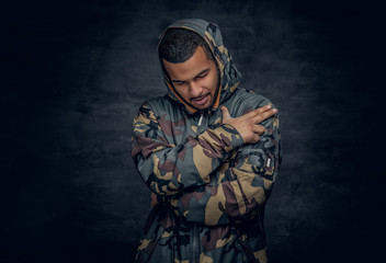  Black man dressed in military jacket.