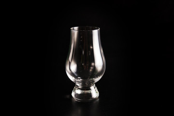 Silhouette of white strong liquor classic glass with clipping path on black background.