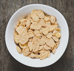 bowl of sugar-coated corn flakes. healthy and useful food for breakfast