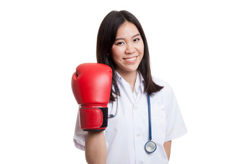 Young Asian female doctor with boxing glove.