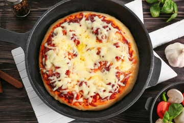 Freshly baked pizza in a pan