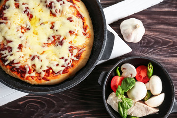 Freshly baked pizza in a pan