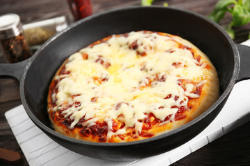 Freshly baked pizza in a pan
