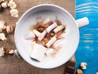 Fresh cappuccino with milk and sweets