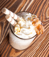 Fresh cappuccino with milk and sweets