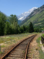 old abandoned railroad tracks between the mountains