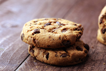 Chocolate cookies on wooden table. Chocolate chip cookies shot