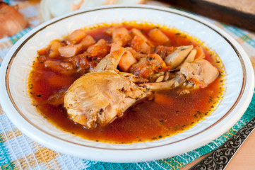 Beetroot soup Chicken on a white plate closeup