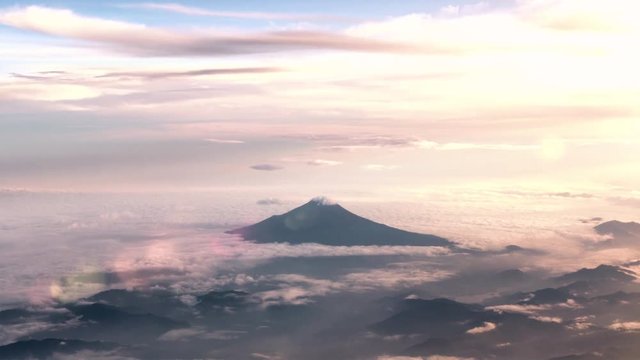 Aerial Tracking View of Mt Fuji covered in clouds at sunset