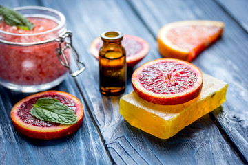 organic cosmetic with citrus on blue background