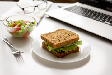 concept of lunch in office at work desktop