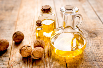 cosmetic and therapeutic walnut oil on wooden background