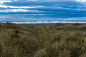 Stormy blue clouds move over the Northern California coastline after a rain