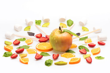 green mint leaves, apple and orange dessert isolated on white