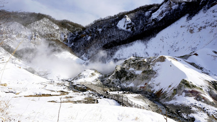 Fototapeta premium Noboribetsu onsen and bridge hell valley snow winter viewpoints