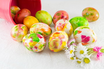Painted Easter eggs and daisy flowers