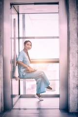 Fototapeta na wymiar Portrait of nurse sitting and holding diary