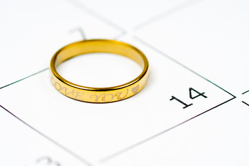 golden ring with love you message over 14 february calendar grid