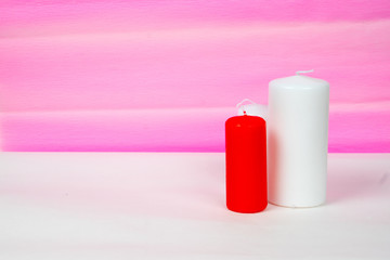 white and red candles with pink striped background