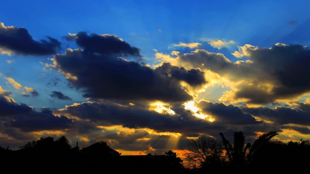 Time lapse video Sunset through clouds