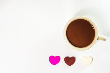 coffee cop and chocolate heart-shaped on white background