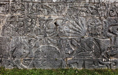 Ancient Mayan mural at the Great Ball Court in Chichen Itza depicting headless body of a player with the snakes streaming out of the neck. The ball game was symbolic of death and rebirth.