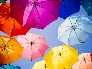 Fototapeta na wymiar colourful umbrella in sunny sky