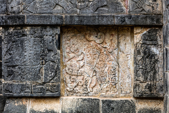 Ancient Mayan murals depicting jaguars and eagles grasping human hearts on the Platform of the Eagles and the Jaguars at Chichen Itza, Yucatan, Mexico