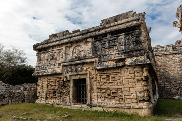 Fototapeta premium Ancient Mayan Terminal Classic governmental palace, constructed in the Puuc architectural style decorated with elaborate masks in Chichen Itza, Yucatan, Mexico.