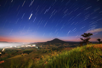 The Beautiful of nature and the night sky filled with stars at  (Khao Takhian Ngo View Point ) , Khao Kho District ,Phetchabun Province in Thailand.
