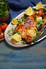 fried chicken legs on an oval platter, rustic style. 