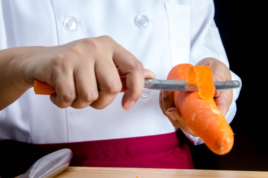 chef peeling carrots