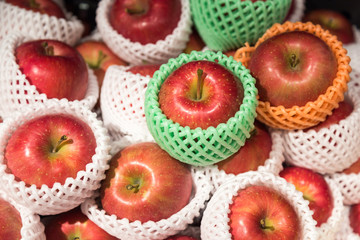Heap of organic juicy apple with protective foam mesh