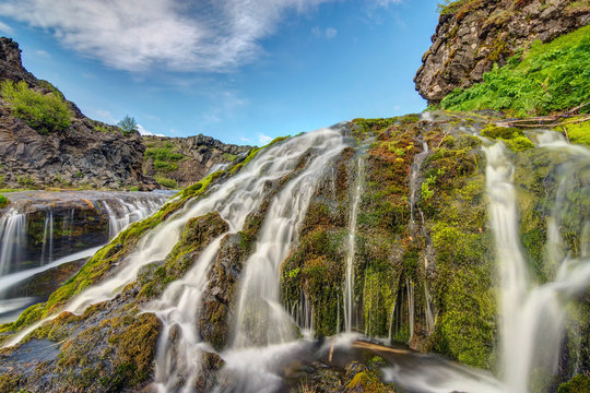 A small waterfall seen in the Gjain valley in Iceland